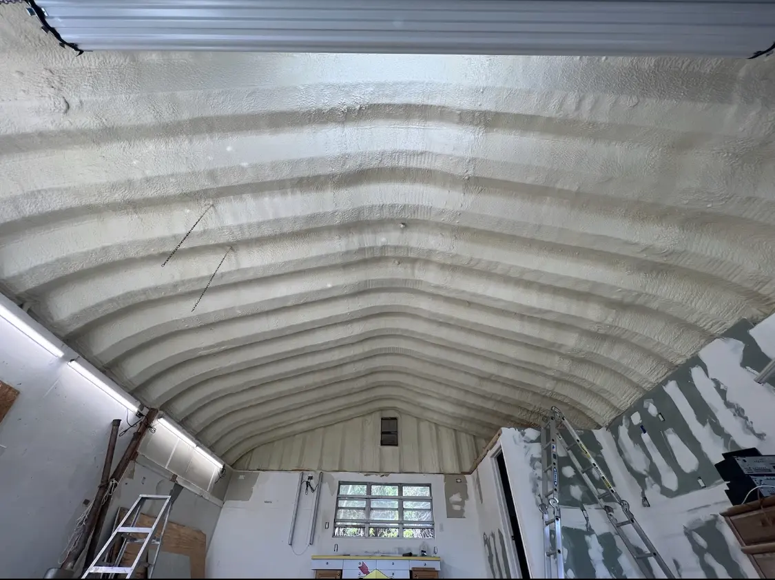 Spray polyurethane foam applied to the underside of a metal roof deck in Collingswood